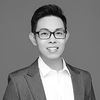 A greyscale headshot of Andy Tay 