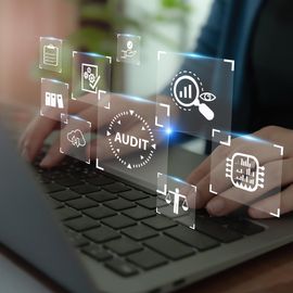 Person typing on a laptop with digital icons representing data analysis and audit trail processes. 