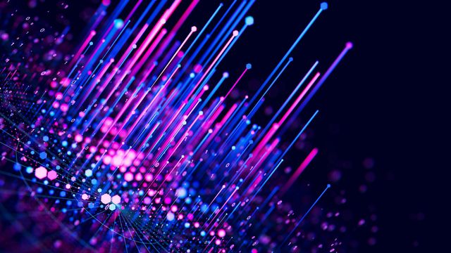 Colorful abstract visualization of mass spectrometry data with glowing lines.
