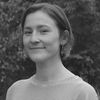 A greyscale headshot of Fiona Hogan Bradford