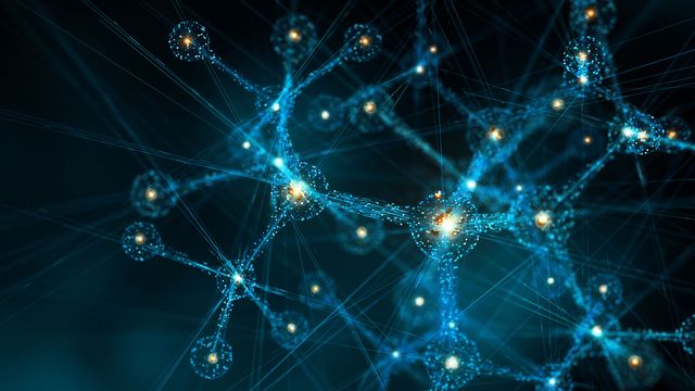 Glowing stick and ball molecules representing AI-driven generative chemistry. 