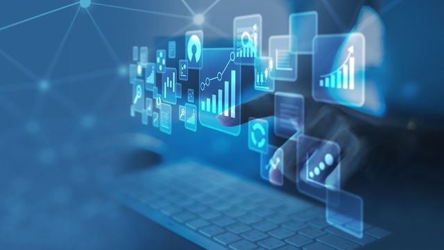 Person analyzing data dashboards with AI-driven data collaboration visuals.