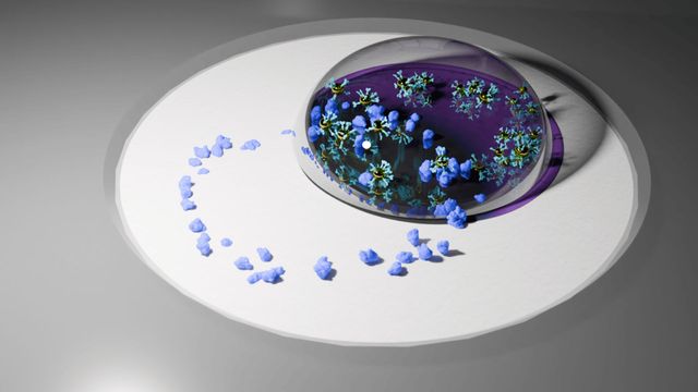 This illustration shows a ring of disease biomarkers, in purple, interacting with a droplet of liquid that contains plasmonic nanoparticles.