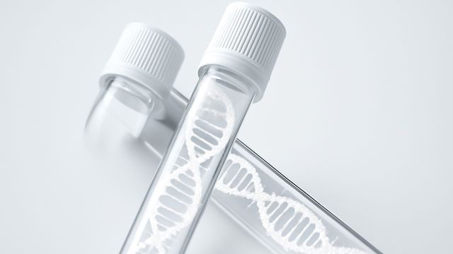 Close-up of test tubes with DNA strands, symbolizing next-generation sequencing (NGS) in the clinic.