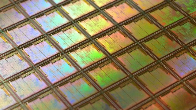 A sheet of iridescent silicon wafers.