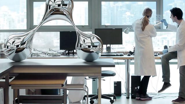 two scientists in a lab with sculpture